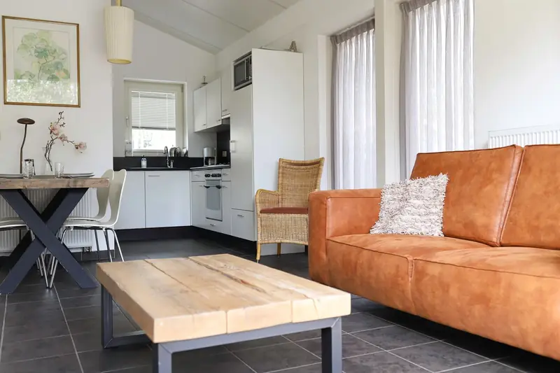 The living room of cottage&nbsp;2, with the kitchen behind it.