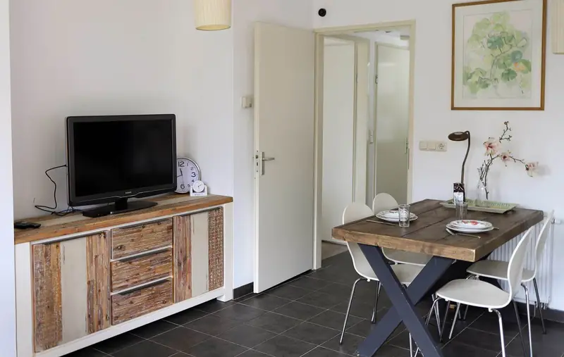 The flat-screen TV and sideboard in the living room of cottage&nbsp;2.